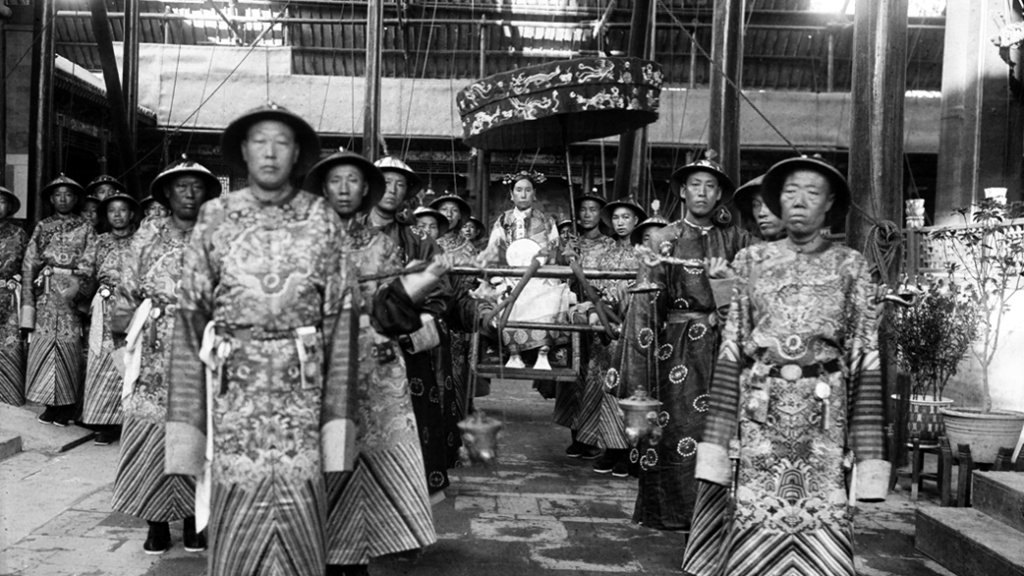 The_Qing_Dynasty_Cixi_Imperial_Dowager_Empress_of_China_On_Throne_Sedan_With_Palace_Enuches
