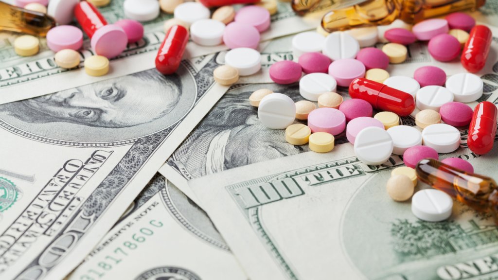 cost medicinal product and treatment concept, pills tablets with cash