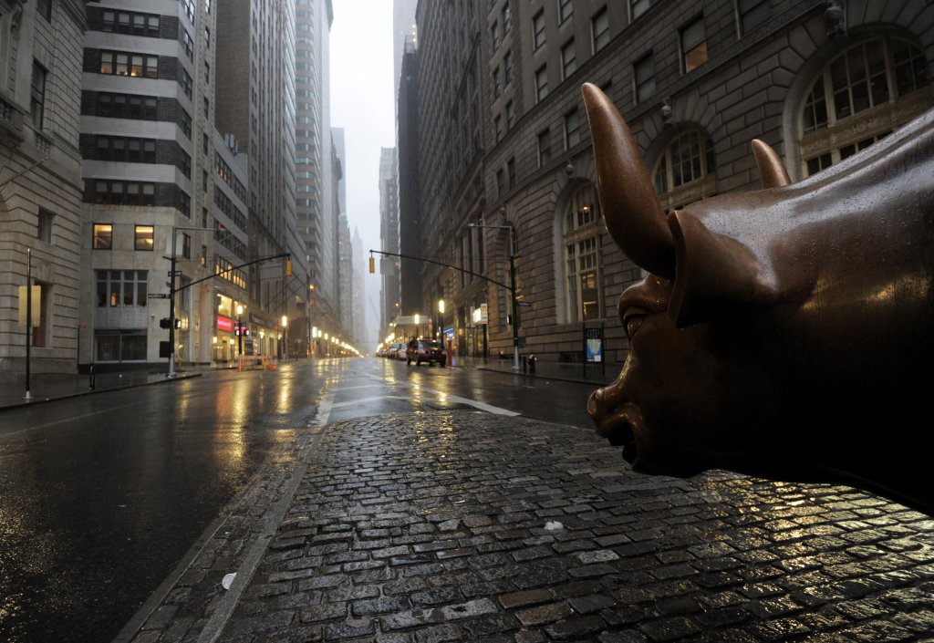 The Wall Street bronze Bull looks out to