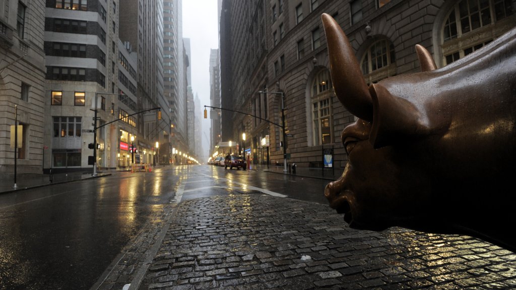 The Wall Street bronze Bull looks out to