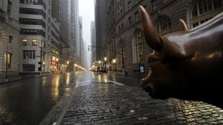 The Wall Street bronze Bull looks out to