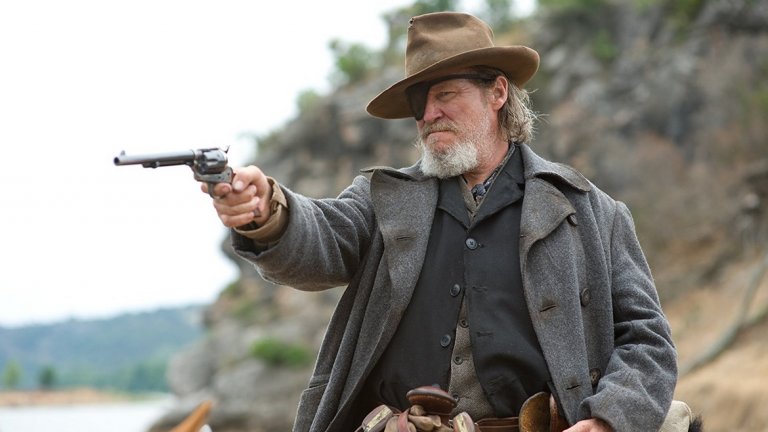 "Непреклонните" / True Grit 
"Непреклонните" от 1969-а с участието на Джон Уейн в ролята на маршал Рустър Когбърн е една от класиките в жанрa на уестърните. Историята в него разказва за млада жена на име Мати, която използва Когбърн, за да открие убиеца на баща си. Филмът е огромен успех и носи наградата "Оскар" за най-добра мъжка роля на Уейн. 
Римейкът му е от 2010 като режисьори са братята Коен, а ролята на Когбърн е поверена на Джеф Бриджес. Той е значително по-мрачен и се опитва повече да се доближи до романа на Чарлз Портис, на който е основан сценарият. Друго преимущество е, че тук действието е разказано почти изцяло от гледна точка на Мати, която описва своето търсене за справедливост. 
От години Холивуд експлоатира темата за Дивия Запад – място, където доброто наистина е добро, а злото – зло. Постепенно на публиката започна да й омръзва това идеализирано виждане и жанрът започна да става по-мрачен. И двата филма са добри, но вторият пресъздава по-точно атмосферата и следва по-внимателно тона на книгата.