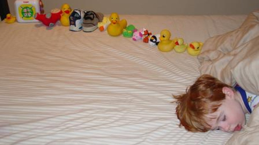 Autistic-sweetiepie-boy-with-ducksinarow