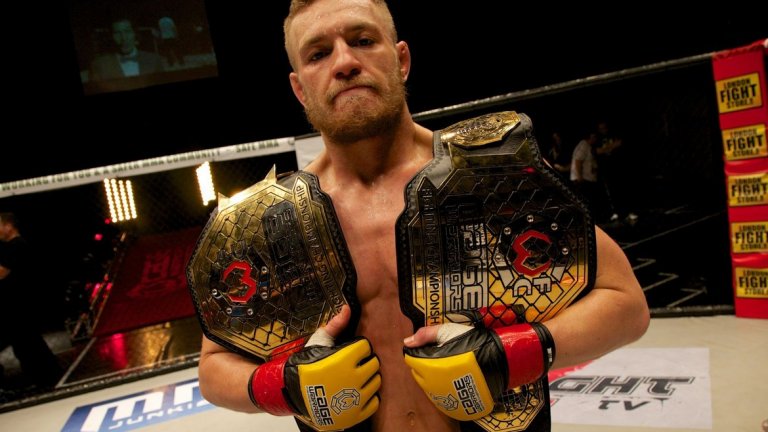 №8 В новогодишната нощ на 2012-а печели титлата на Cage Warriors
Ирландецът нокаутира ИВан Бухингер за 3 минути и 40 секунди в първия рунд, за да спечели титлата, която му осигури шампионски колани в две различни категории. Получи и титлата в категория “перо” на Cage Warriors на 2 юни 2012-а. Победата му срещу Бухингер бе последният му мач извън UFC и е от огромно значение, за да покаже, че е готов за голямата сцена. Бухингер е първият му наистина сериозен противник и именно тогава си проличава огромният потенциал на Макгрегър.
