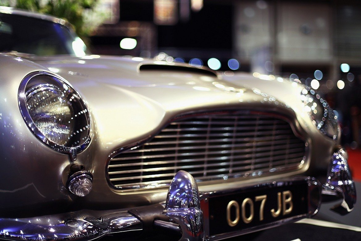 Aston Martin DB5 се появява за последен път на голям екран през 2012 г. в "Координати Skyfall". Тогава публиката и особено запалените фенове на поредицата на Бонд са във възторг, че отново виждат такава класика пред очите си и то кола на 007.

Всъщност обаче двата автомобила, използвани във филма, са "клонинги" на оригиналния DB5. Те са изключително точни копия и е почти невъзможно да бъдат посочени разлики с първообразите им. Това е и причината обаче автомобилите Aston Martin от "Координати Skyfall" да не се продават.