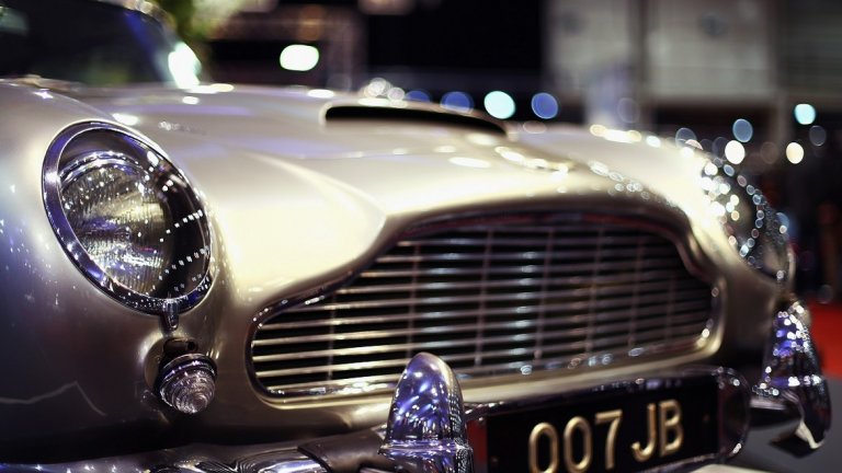 Aston Martin DB5 се появява за последен път на голям екран през 2012 г. в "Координати Skyfall". Тогава публиката и особено запалените фенове на поредицата на Бонд са във възторг, че отново виждат такава класика пред очите си и то кола на 007.
Всъщност обаче двата автомобила, използвани във филма, са "клонинги" на оригиналния DB5. Те са изключително точни копия и е почти невъзможно да бъдат посочени разлики с първообразите им. Това е и причината обаче автомобилите Aston Martin от "Координати Skyfall" да не се продават.