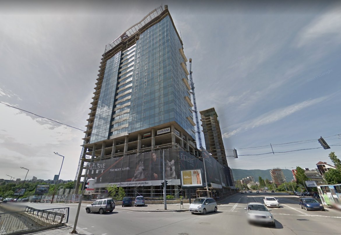 "Милениум Център" - 85 метра, 32 етажа, незавършен

Новата сграда, издигаща се в близост до НДК, бул. "Витоша", бул. "Пенчо Славейков" и бул. "България" е известна още и като "небостъргача на НИКМИ" по името на строителната компания-инвеститор. Първите от общо 37-те апартамента в жилищната част на сградата вече са продадени. В сградата, на чиито покрив има вертолетна площадка, ще има още офиси, търговски обекти, петзвезден хотел, паркинг на пет нива. По план "Милениум" трябва да бъде завършена до средата на тази година.
Снимка: Google Maps