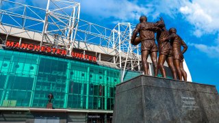 The United Trinity bronze sculpture at Old Trafford stadium in Manchester, UK