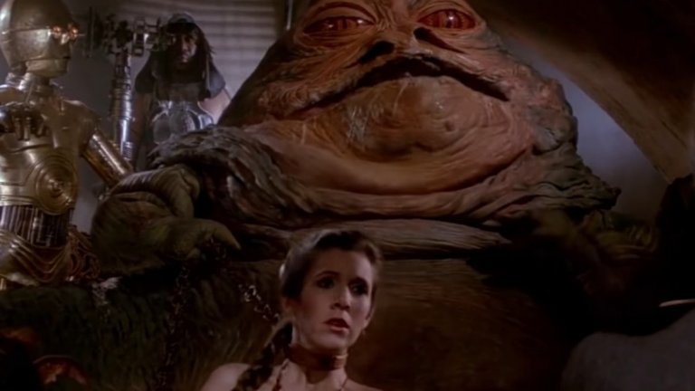 9. Джаба – Масивното, подобно на червей тяло на Джаба Хътянина, разплуто в покоите му, а пред него лежи Принцеса Лея (Кери Фишър) по оскъдно облекло и с верига около врата си. Това е една от най-знаковите картини от "Завръщането на джедаите". През първата половина на филма Джаба е едва ли не основният злодей, след като планът му се е осъществил и той държи в плен замразения Хан Соло.
Противният му външен вид и безпощадното му отношение дори към собствените му подчинени правят персонажа дори още по-несимпатичен. Джаба е олицетворение на дебелия мафиотски бос, който контролира своето собствено "царство", споразумявайки се с властта (Империята). Но прави грешка. Люк Скайуокур му предлага сделка, която Джаба "не може да откаже". Той все пак прави точно това и така намира смъртта си, удушен от доскорошната си робиня Лея.