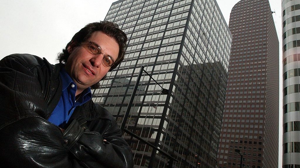 Kevin Mitnick, the worlds most notorious hacker poses for a portrait outside the Cash register building in downtown Denver where he worked under the alias id Eric Weiss at the Law firm of Holme, Roberts and Owen. (Craig F. Walker / The Denver Post)