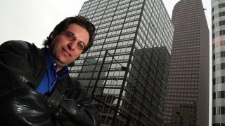 Kevin Mitnick, the worlds most notorious hacker poses for a portrait outside the Cash register building in downtown Denver where he worked under the alias id Eric Weiss at the Law firm of Holme, Roberts and Owen. (Craig F. Walker / The Denver Post)