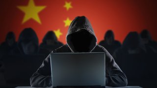 Many chinese hackers in troll farm. Privacy and security concept.