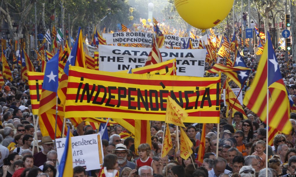 People hold banner reading "independence" during a protest for greater autonomy for Catalonia within Spain in Barcelona