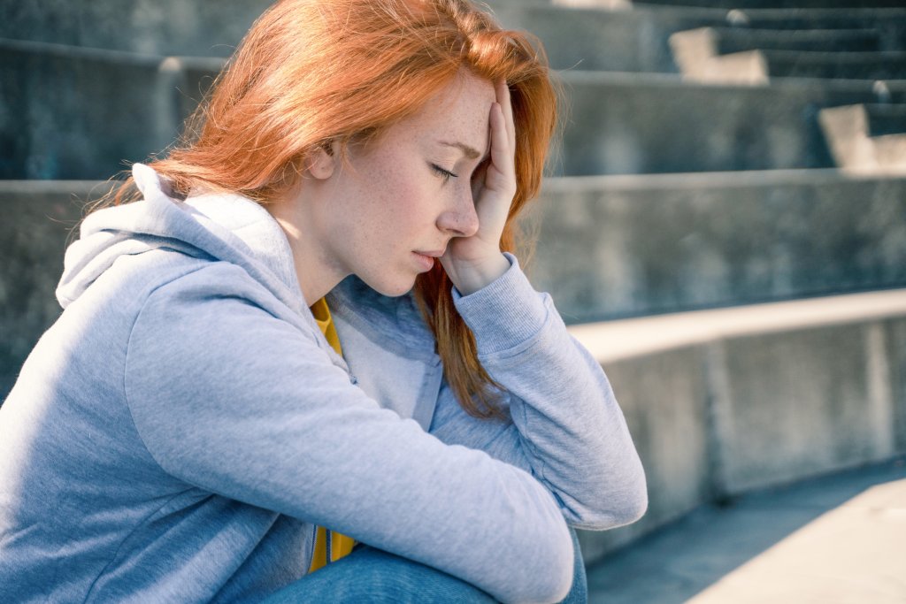 One depressed young woman feeling negative feelings