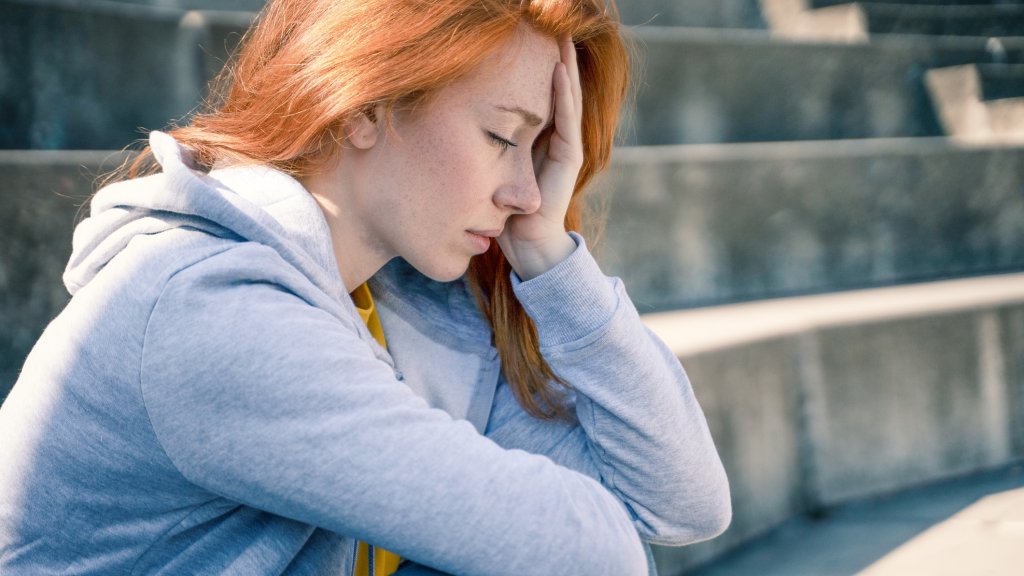 One depressed young woman feeling negative feelings