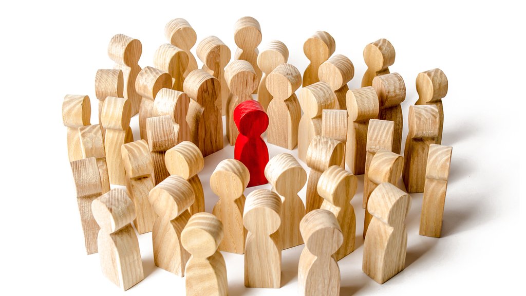A crowd of people surrounded the red man. Accusation of crime, lynch court. The leader in the center. Angry mob. Attracting new members to the team. General support and mutual assistance.
