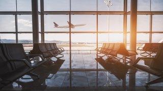 Airport waiting room, flying plane