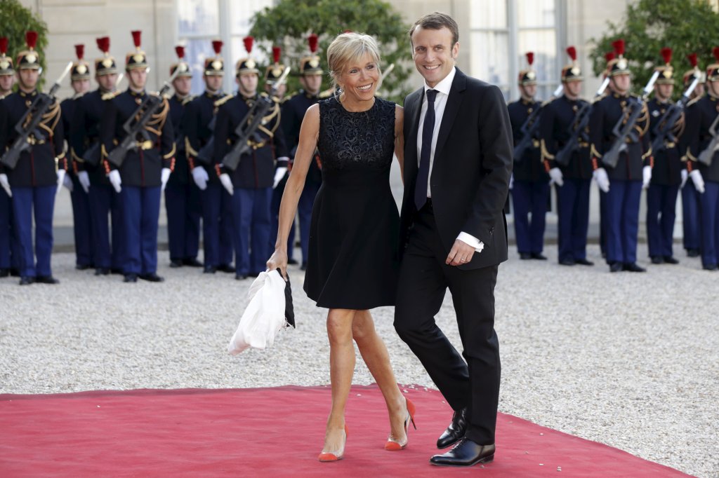 French Economy minister Macron and his wife Trogneux arrive at the Elysee Palace in Paris