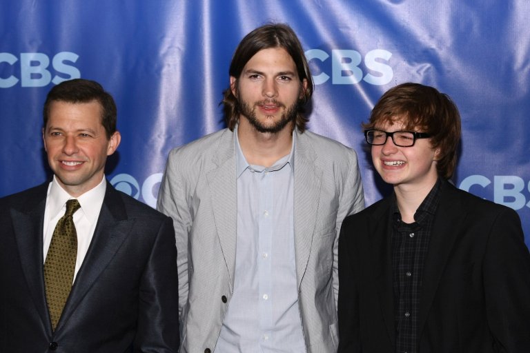With Jon Cryer and Ashton Kutcher in 2011.