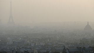 Air pollution in Paris : Eiffel tower through a haze of pollution in Paris
