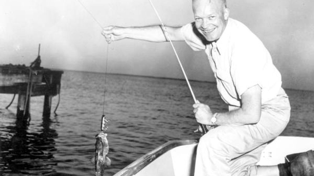 Dwight_Eisenhower_landing_a_grouper_(8056378483)