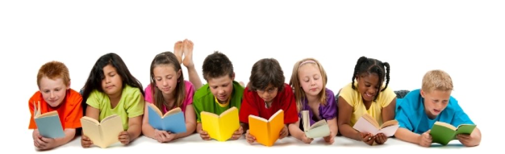A group of diverse children reading a book.