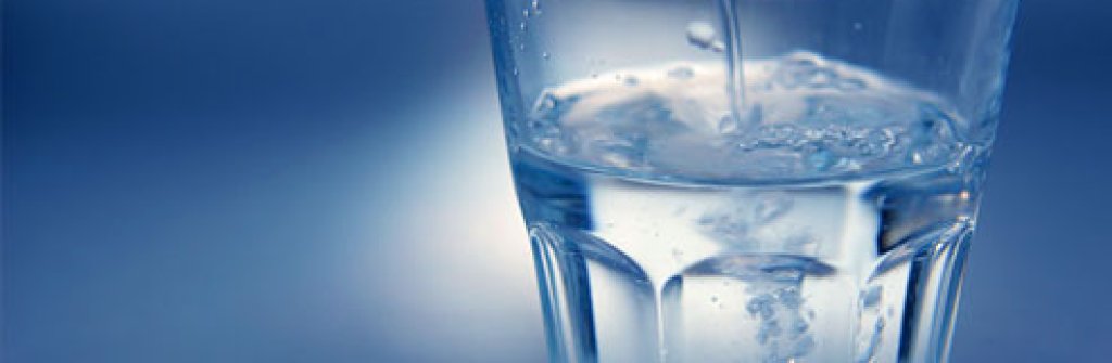 istock_photo_of_pouring_water_into_glass