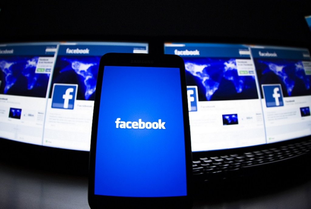 The loading screen of the Facebook application on a mobile phone is seen in this photo illustration taken in Lavigny